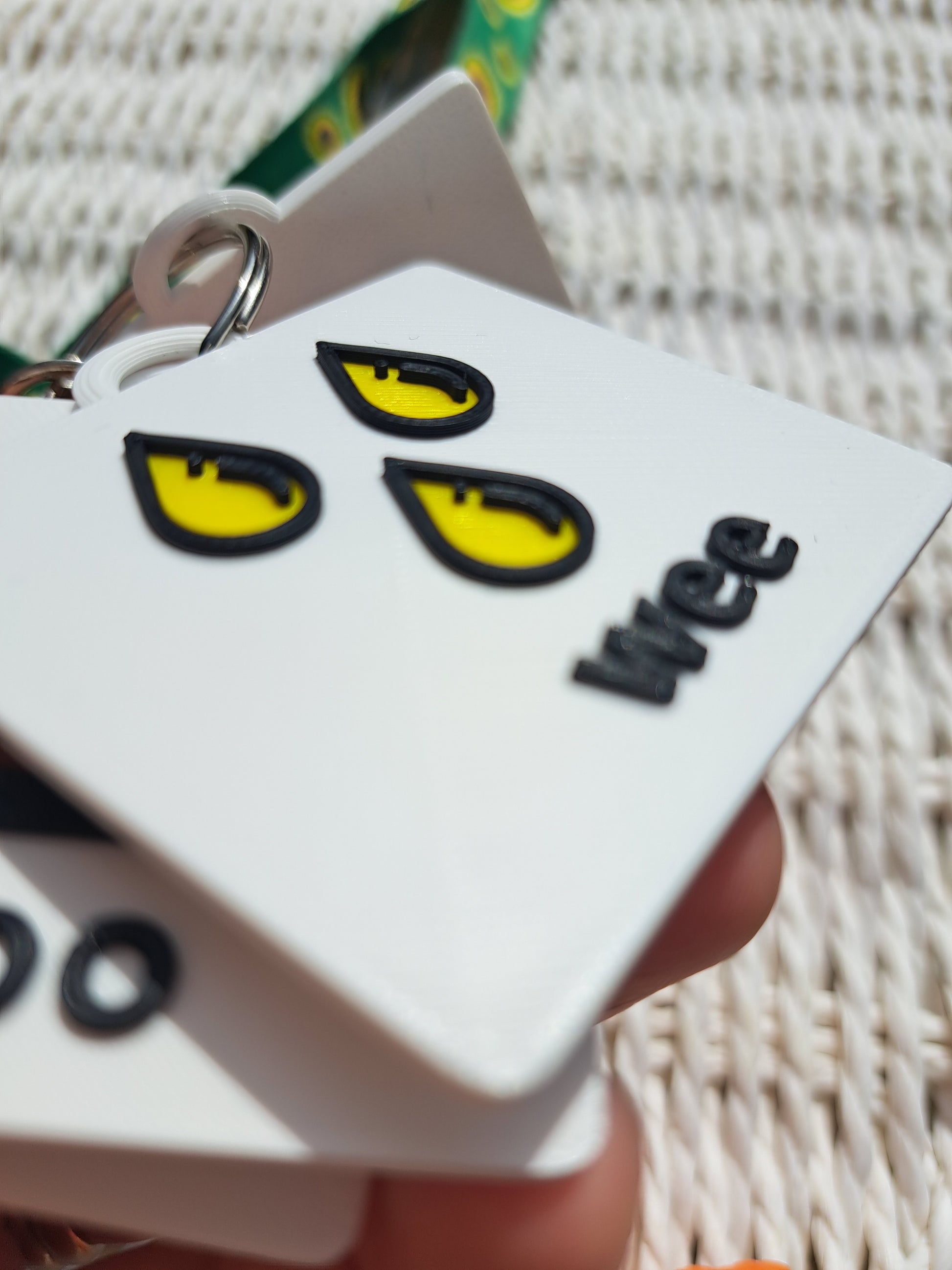 Close-up of the ‘wee’ tag from the toilet communication set, showing raised text and symbol.