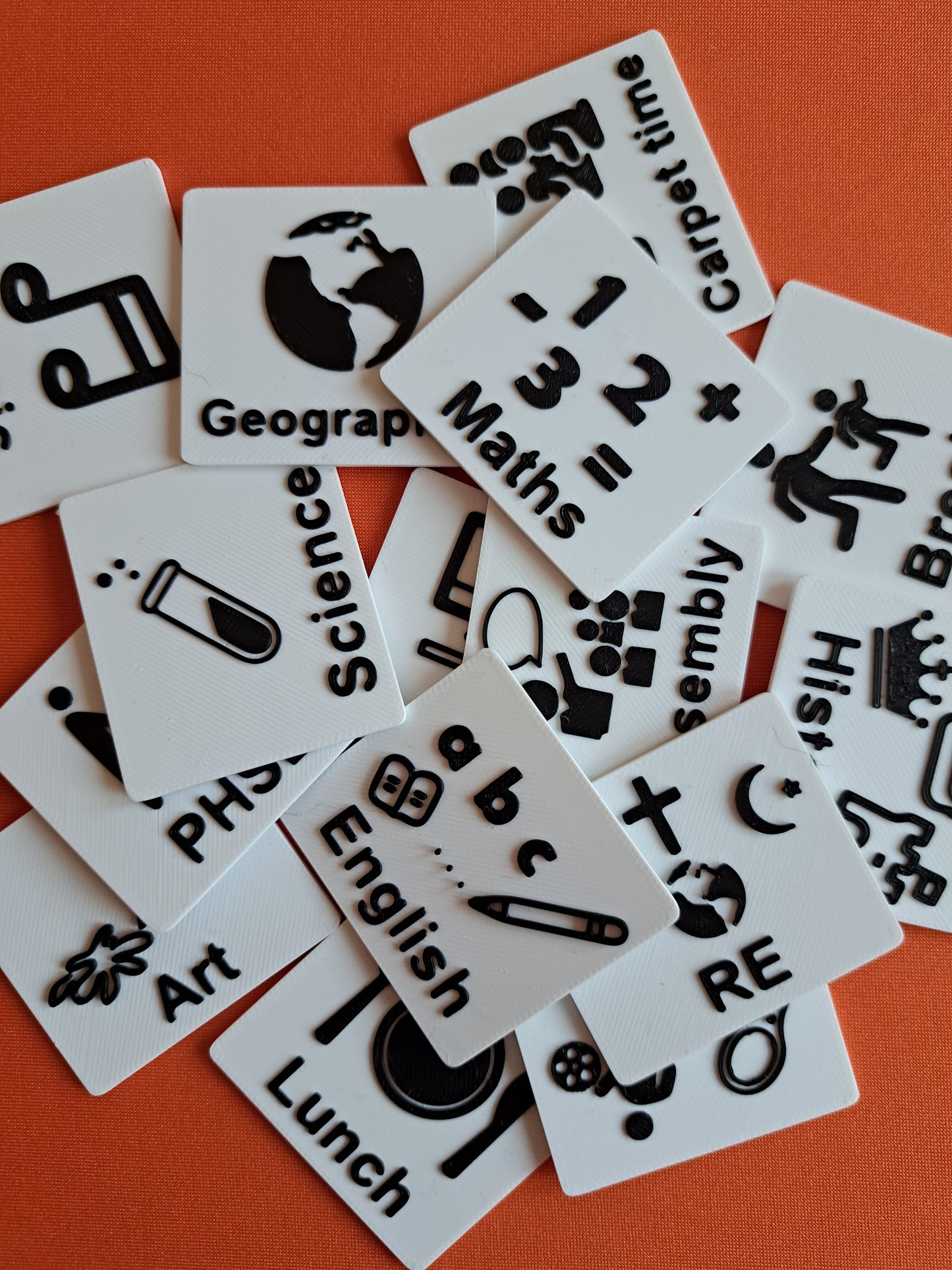 Autism communication tags for school subjects like PE, reading, and lunch.